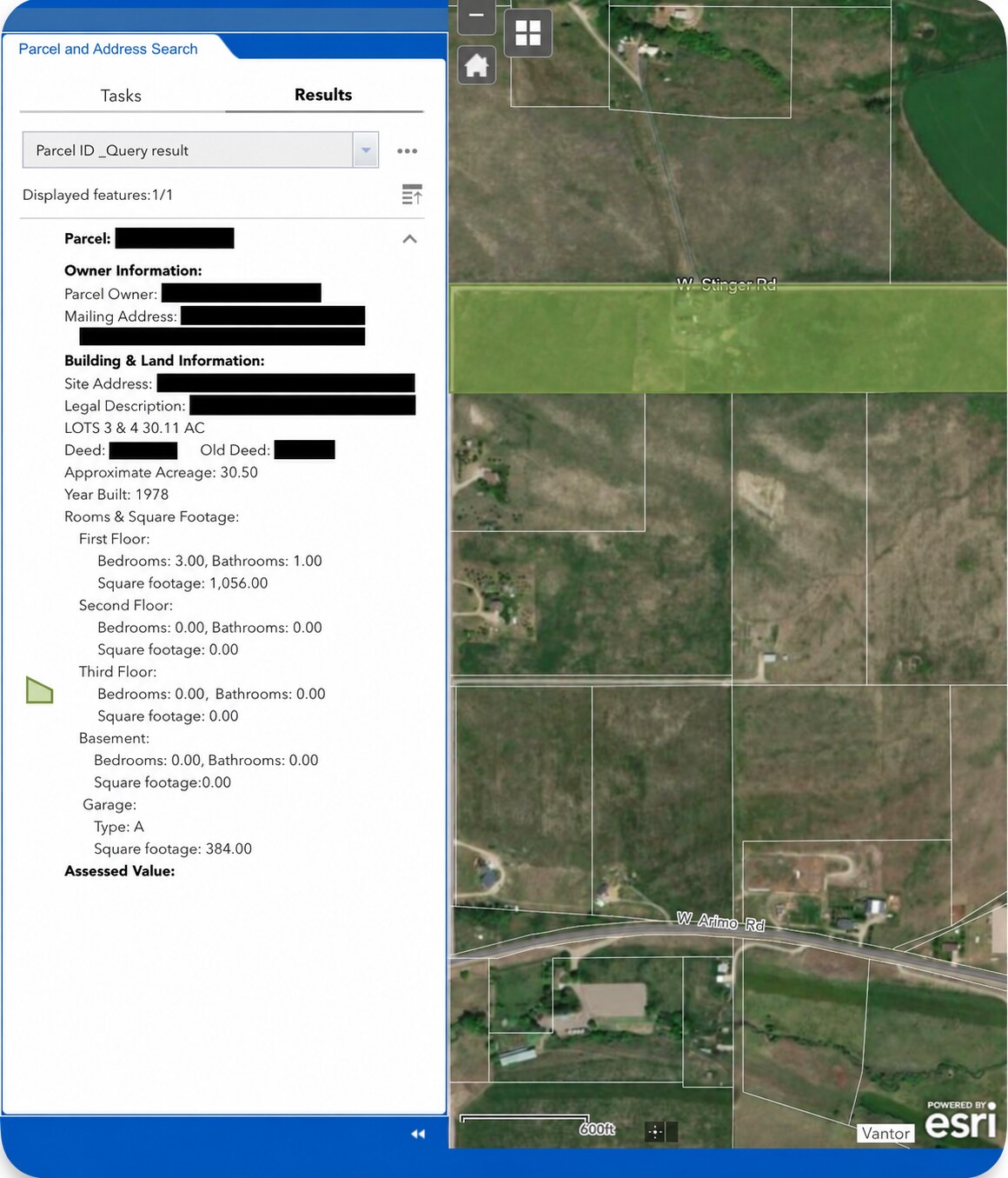 County parcel search result with identifying and financial details concealed